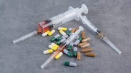 Assorted pharmaceutical capsules and syringes with serums. High quality photo