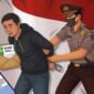 Ilustrasi penangkapan pelaku pemerasan./Kreasi AI