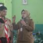 Sekretaris Dinas Pemberdayaan Perempuan, Perlindungan Anak, Pengendalian Penduduk, dan Keluarga Berencana (P3AP2KB) Lampung Timur, Titin Wahyuni, saat sosialisasikan bullying dihadapan Siswa-siswi. (Foto: Agus S)